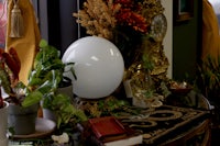 three flowers in a vase on a table